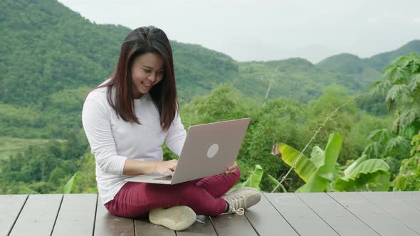 Woman Enjoying With A Laptop At Beautiful View