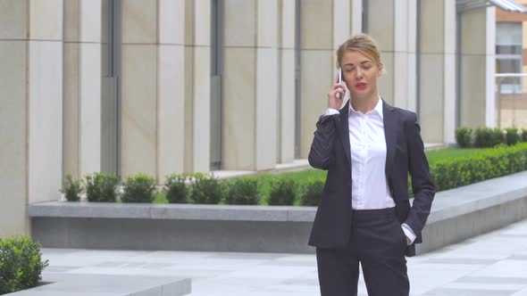 Beautiful Business Woman on the Phone at Modern Building