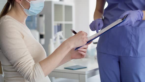 Video of pregnant woman signs documents before vaccination. Shot with RED helium camera in 8K.