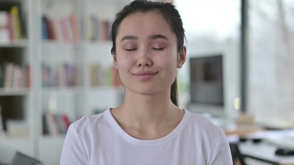 Portrait of Yes Sign By Young Asian Woman Shaking Head