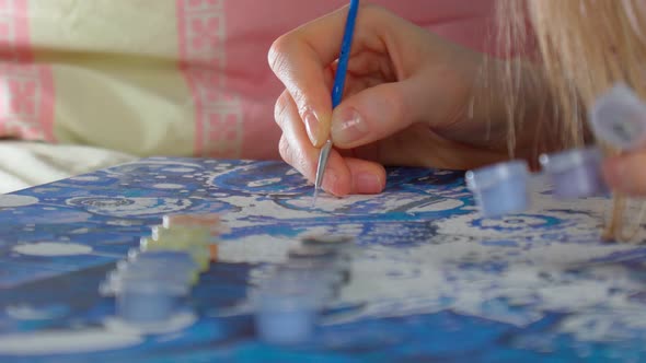 Close Up of Woman Artist Hand Holding Paint Brush and Drawing Oil Painting