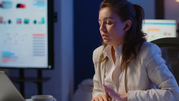 Employee Having Video Conference Working Overtime From Business Office