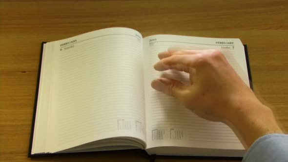 WS, Time lapse, Hand turning pages of DiaryHand turning pages of Diary