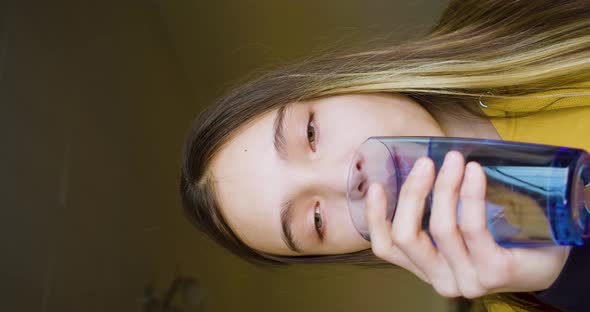 Close Up Vertical Video of a Cute 10 Years Old Girl Drinking Glass Fresh Transparent Pure Filtered