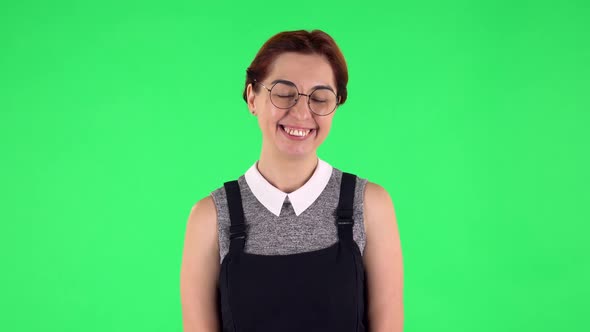 Portrait of Funny Girl in Round Glasses Is Standing Worrying in Expectation Then Proud of Himself