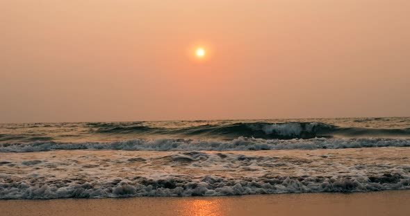 Amazing Beach Sunset with Endless Horizon and Lonely Figures in the Distance and Incredible Foamy