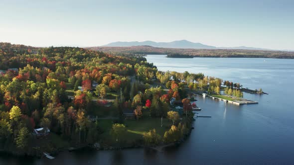 Beautiful Still Water Surface at Autumn Forest with Foliage Trees Aerial Lake