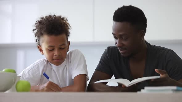 Dad Helping Son Do School Homework Spbi