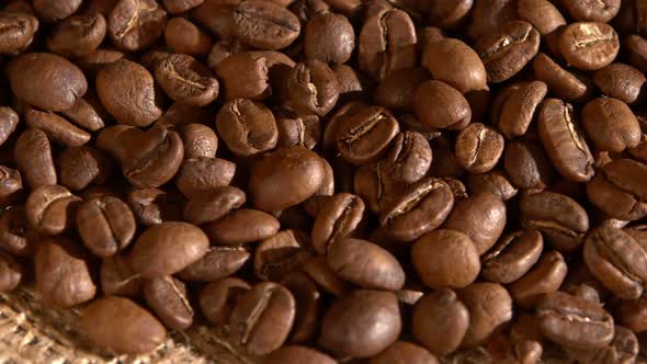 Coffee Beans on Burlap Sacking, Background, Close Up, Rotation, Cam Moves To the Right