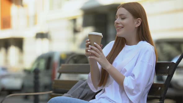 Teenage Girl Drinking Beverage and Burning Her Lip With Hot Drink, Morning