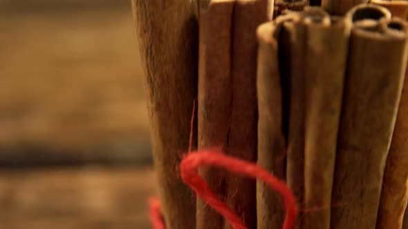 Tied cinnamon sticks on table