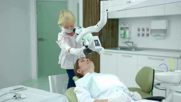 Little Girl Looks at the Dentists Teeth