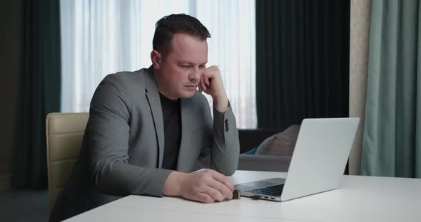 Work Online. Man In Business Suit Working At Computer Sitting At Home