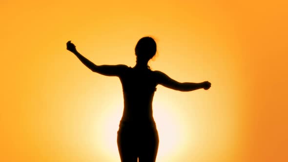 Silhouette of Slim Female Practicing Yoga at Sunset, Meditation and Healthcare