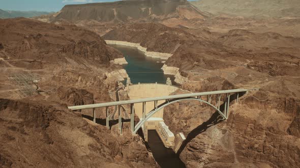 Aerial wide shot of Hoover Dam on sunny summer hot day