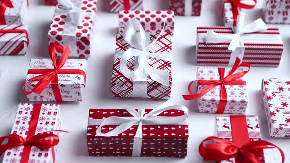 Colorful White and Red Christmas Theme. Wrapped Gifts in Festive Paper with Ribbon