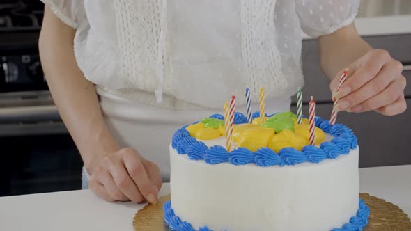 Attractive Woman Preparing A Birthday Cake
