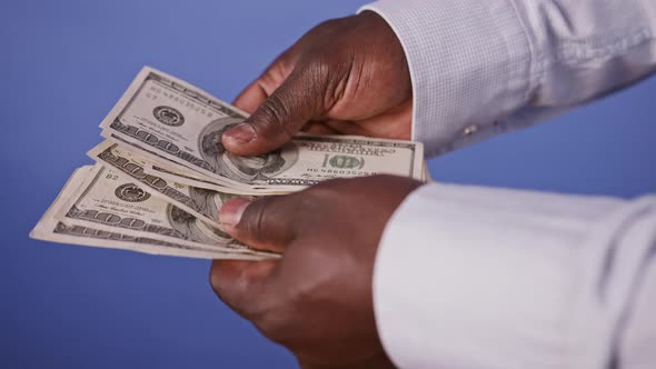 Hands of an Black African American Counting Loan Money - Mortgage and Savings Concept