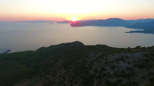 Morning Sunrise Over Forested Hills on the Seashore