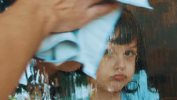 Mother with a Child By the Window