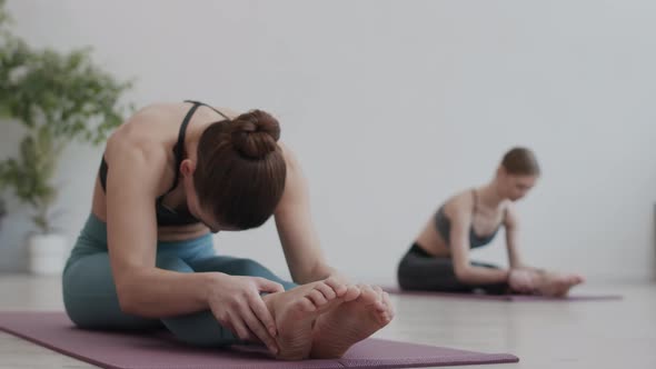 Active Caucasian Woman on Yoga Training