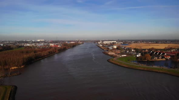 Aerial Dolly Left Across River Noord On Clear day