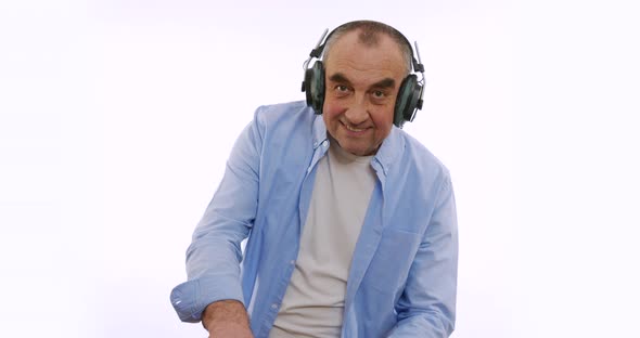 The Old Man in Headphones, Listening To Music, Dancing, Smiling, Cheerful. A Very Funky Elderly