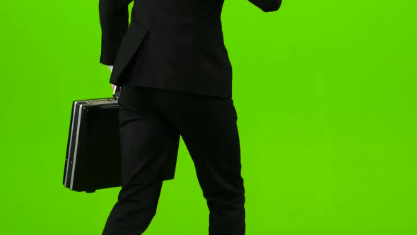 Businessman He Has a Diplomat in His Hands, the Phone Rings and He Starts To Run. Green Screen. Back