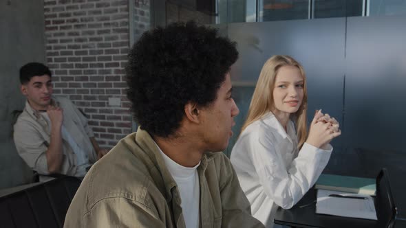 Young Diverse Group Students Sitting in Classroom at Lesson Answering Question Discussing New Topic