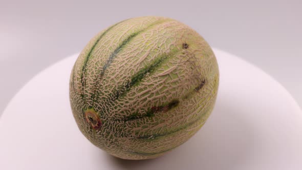 Close up view of Cantaloupe melon isolated on background.