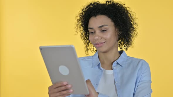 Portrait of Hardworking Casual African Woman Using Tablet