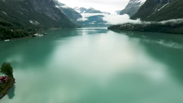 Amazing view of the turquoise Loen lake in western Norway. Camping ground visible in the distance.