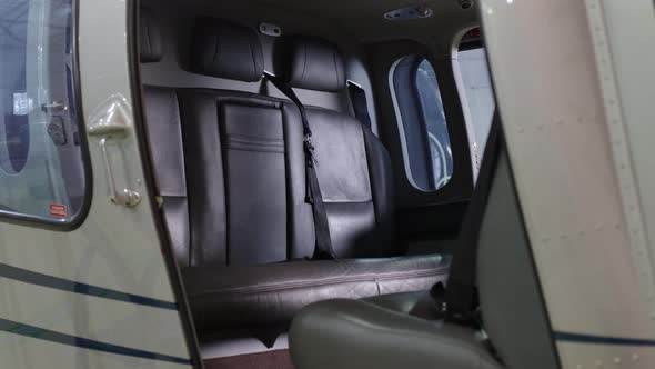 Interior of Passenger Helicopter in Gray Leather in Hangar