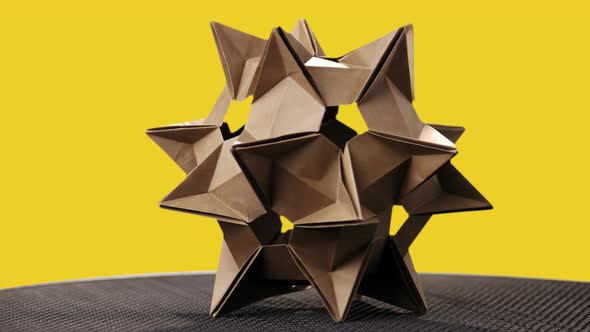 Origami Cosmic Figure on Yellow Background.