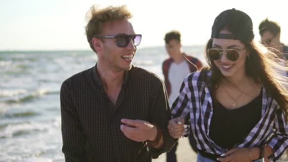 Couple Walking and Talking Laughing Happy Joyful and Playful Enjoying Nature Landscape By the Beach