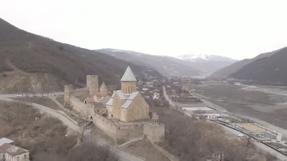 Aerial view of old Ananuri Fortress with two churches and picturesque view on river,  Georgia 2021