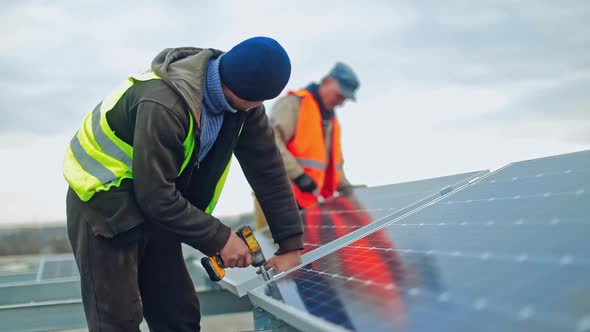 Technician connecting solar panel