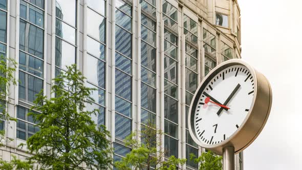 Time Lapse of Clock and Office Building