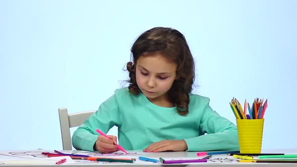 Child Begins To Draw His Drawing with Different Pencils. Close Up. Slow Motion