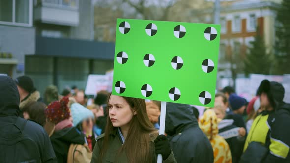 Young Adult Angry Feminist. Blank Banner in Hand. Anger Feminism Strike Out .