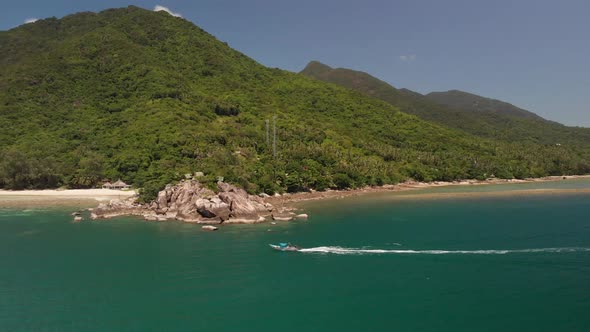 Aerial view of speeding boat near the white sand beaches of Koh Phangan District Surat Thani in Thai