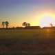 Aerial Cinematic Clip Drone Flying Over a Farm Field During Sunset - VideoHive Item for Sale