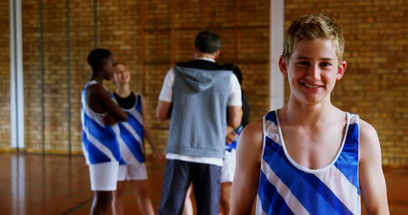 High school boy standing in basketball court 4k