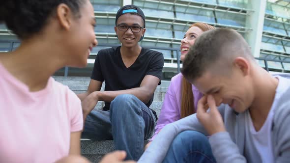 Group of Friends Talking on School Stairs After Lessons, Teen Friendship