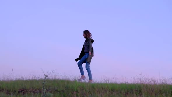 Woman Dancing While Walking on the Nature