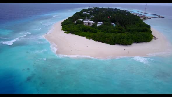 Aerial above sky of idyllic seashore beach time by blue green lagoon with white sandy background of 