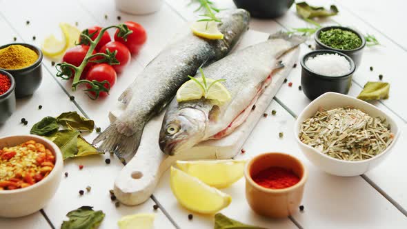 Spices and Tomatoes Around Fish