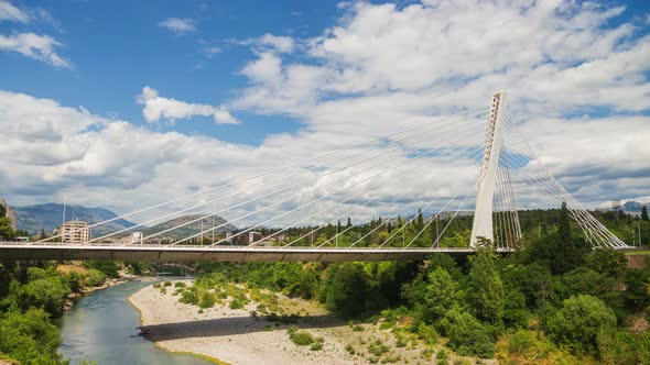 Podgorica Montenegro - Millennium cable stayed bridge over Moraca river under fast moving clouds