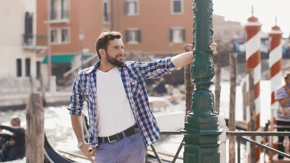 Handsome Tourist Man Travel in Venice, Italy.