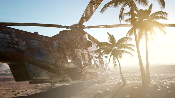 Old Rusted Military Helicopter in the Desert at Sunset